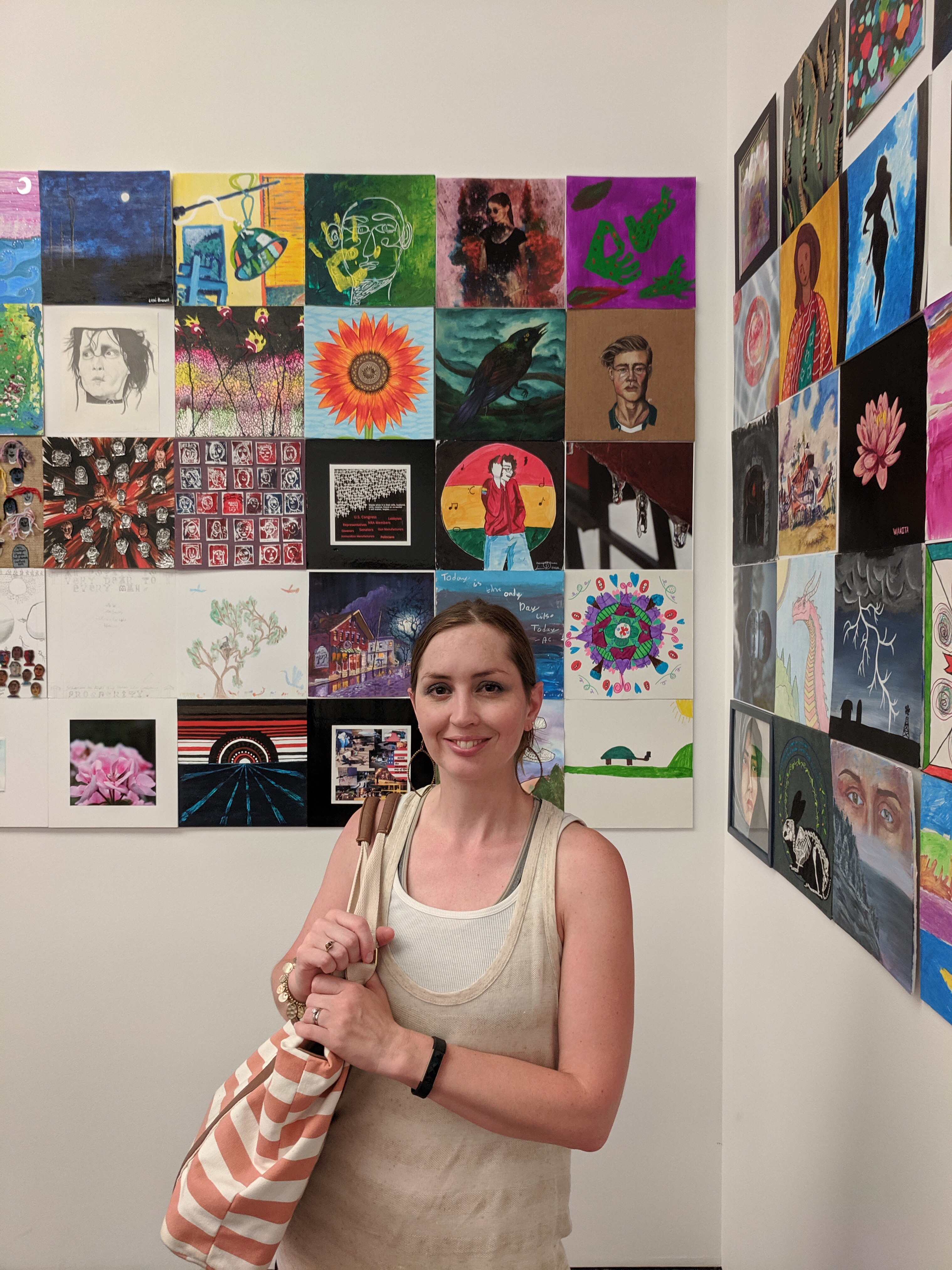 Shalom Schultz in front of her work, “Sunflower Study”—part of a community art exhibit at Figge Art Museum in Davenport, IA.